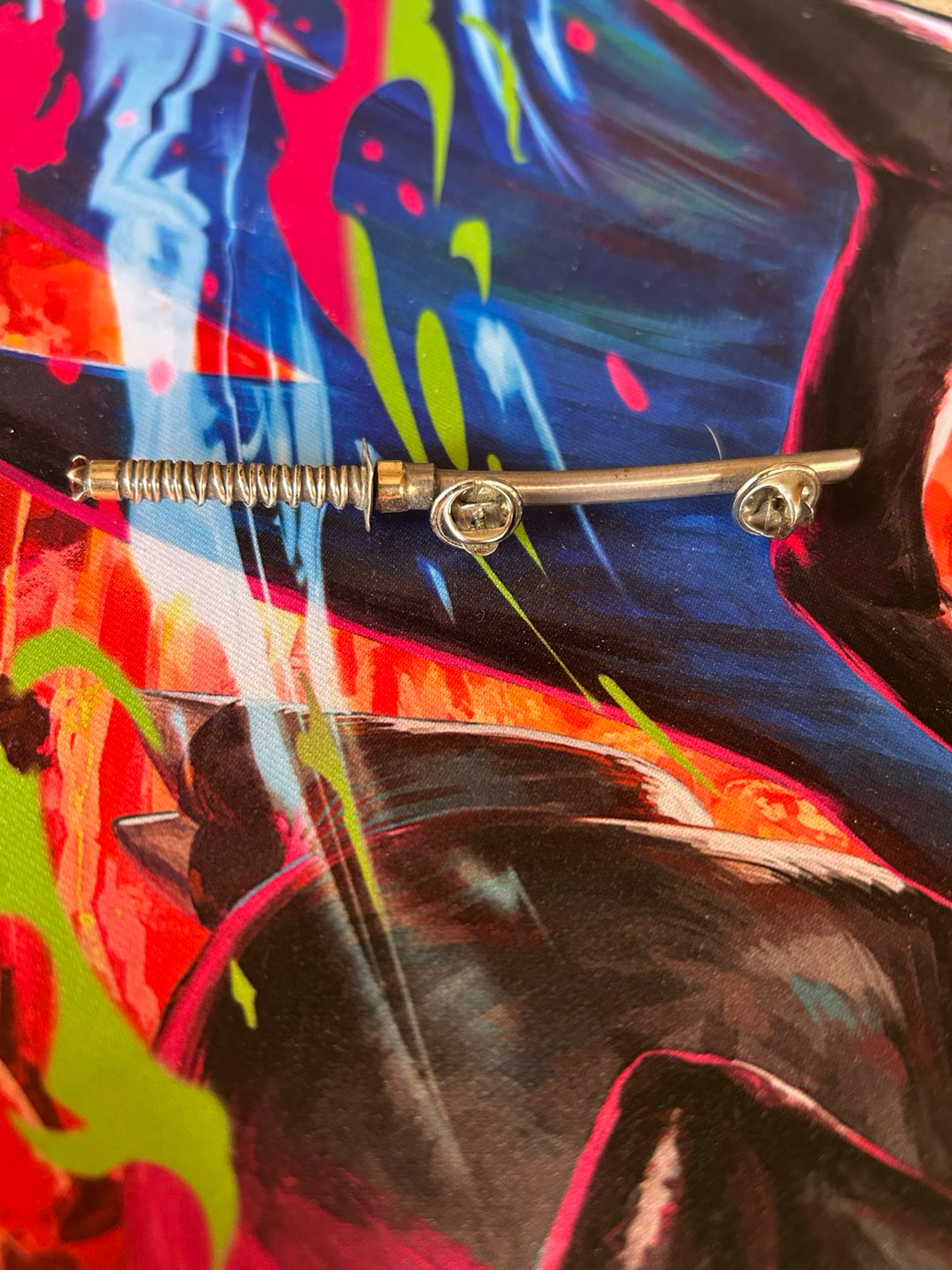 Preview pic of Daburi sword with hat pins on sheath  red gem