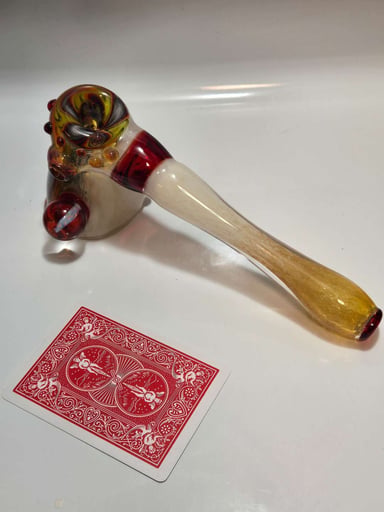 Preview pic of Amber/black/white swirl hammerhead with red marbles.