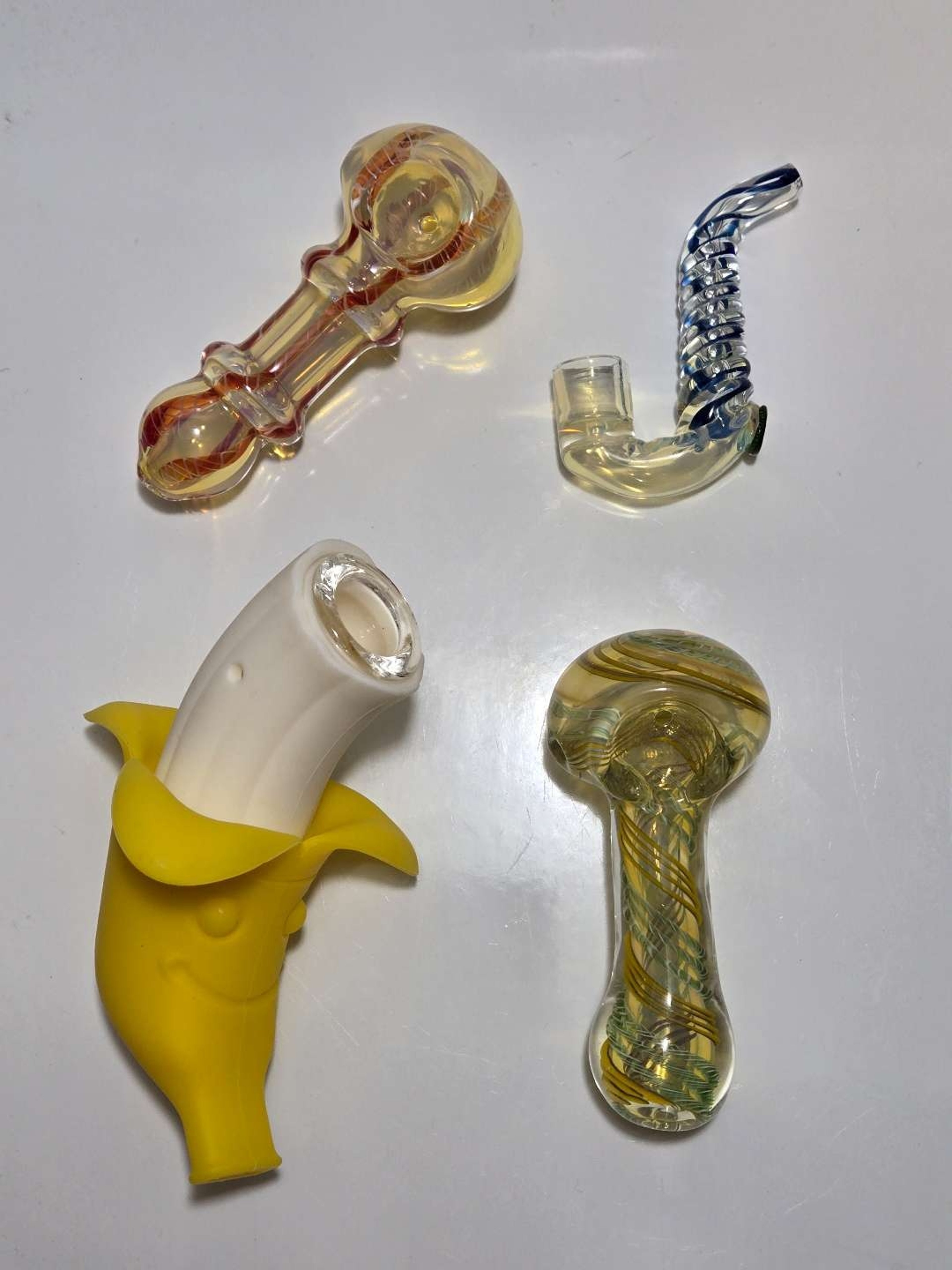 Preview pic of Glass Pipe Lot - 4 Pieces - Spoon, Sax Pipe, Silicone Banana Pipe
