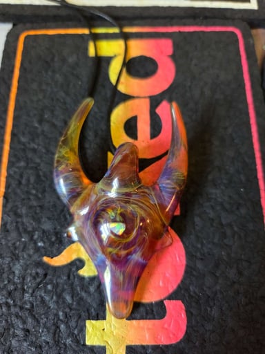 Preview pic of Amber purple opals encased horned pendy