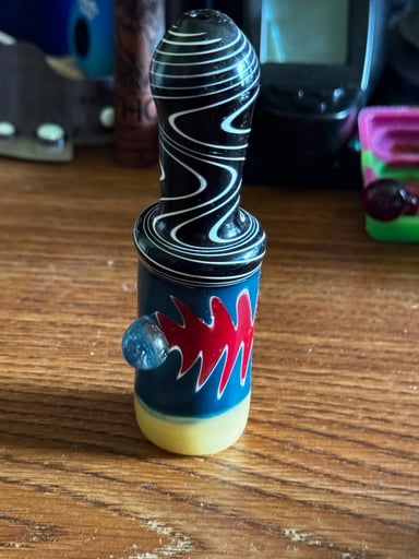 Preview pic of Black + white swirl top chillum with blue body + red flame work and yellow base