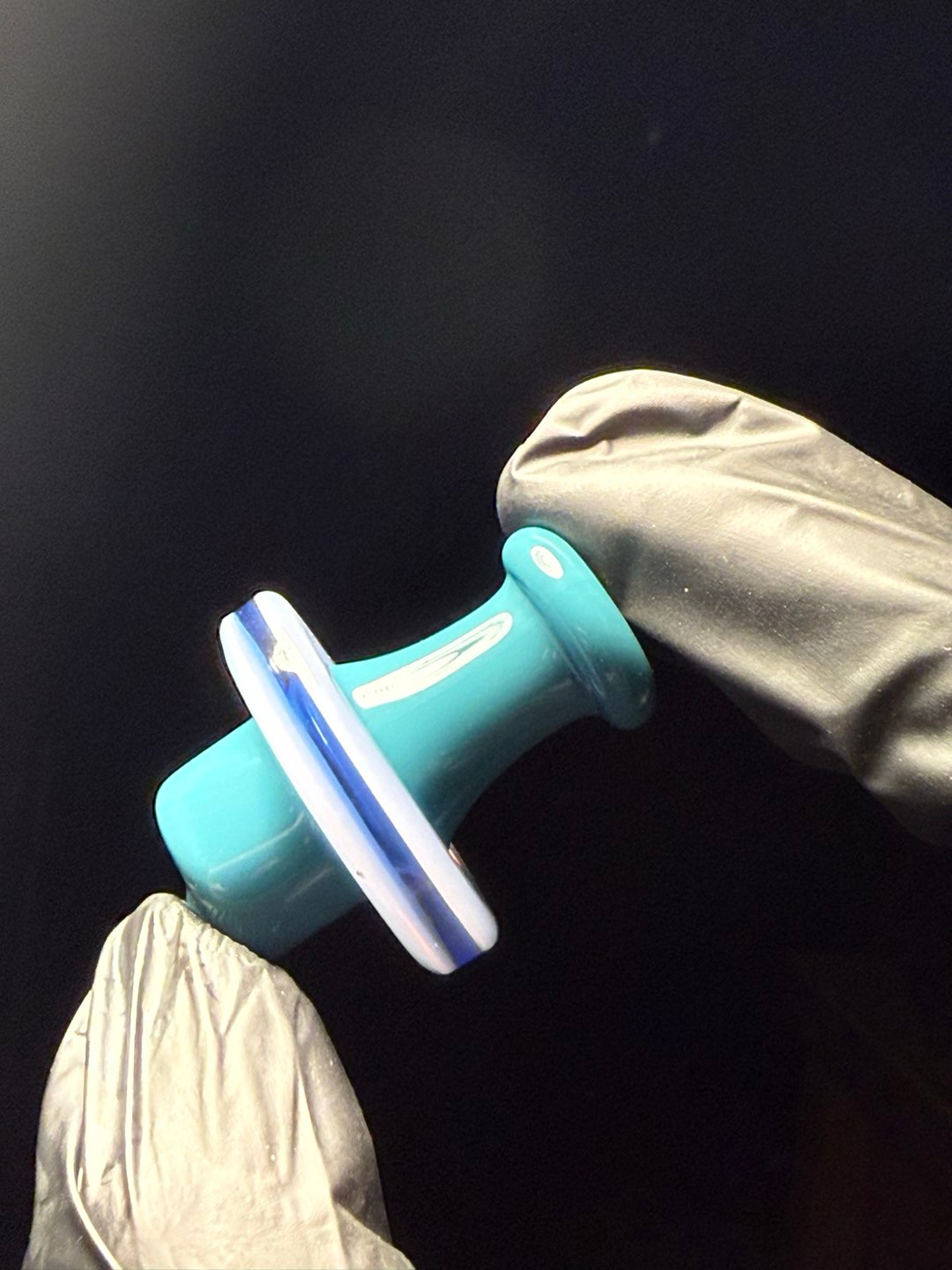 Preview pic of Opaque aqua and jade pink over light blue spinner cap!