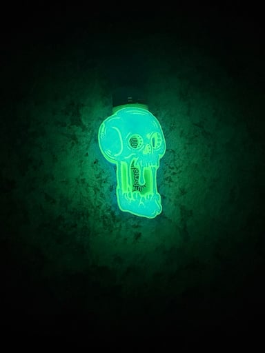 Preview pic of 💀 Glow-in-the-Dark Melting Skull Bic Lighter Sleeve 💥