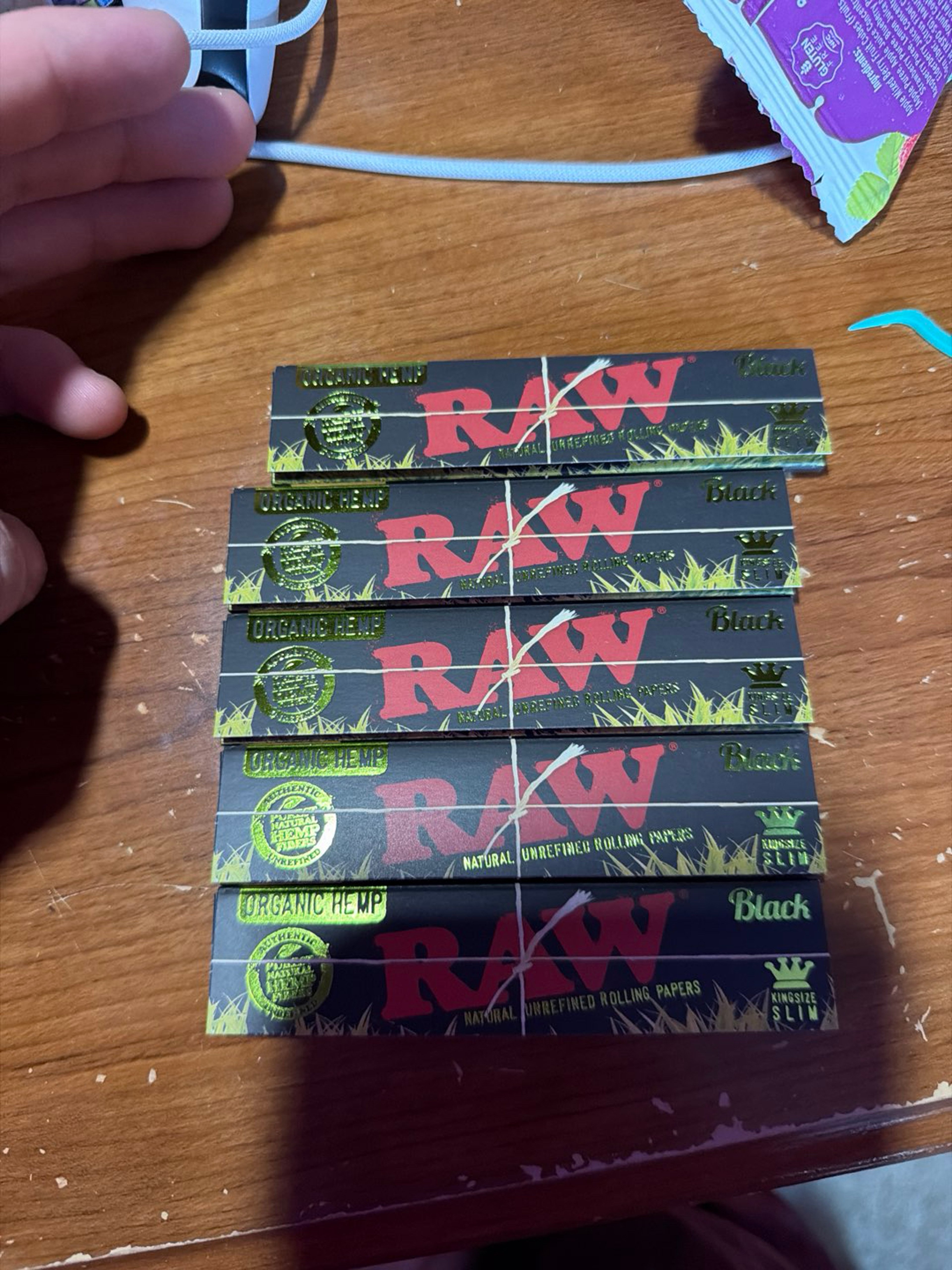 Preview pic of 5 brand new packs of raw black organic hemp king size rolling papers