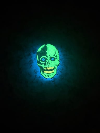 Preview pic of Two-Tone Split Skull Bic Lighter Sleeve – (Green Glow)
