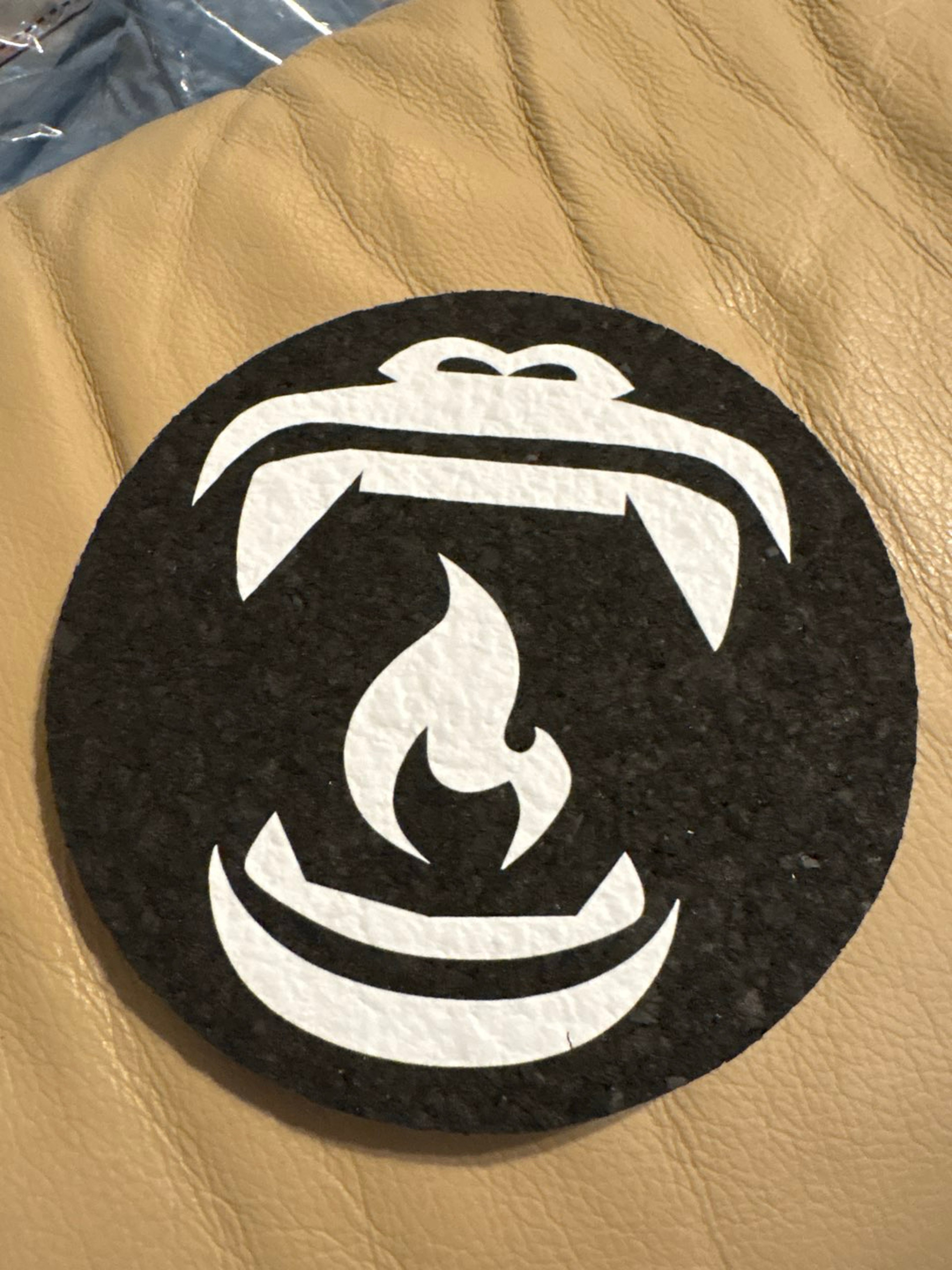 Preview pic of @BabyGorillaGlass X MoodMats  gorilla's wide-open mouth and fangs with a central flame symbol