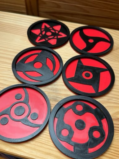 Preview pic of Naruto Uchiha Clan Sharingan Coaster Set with Holder (6-Piece)