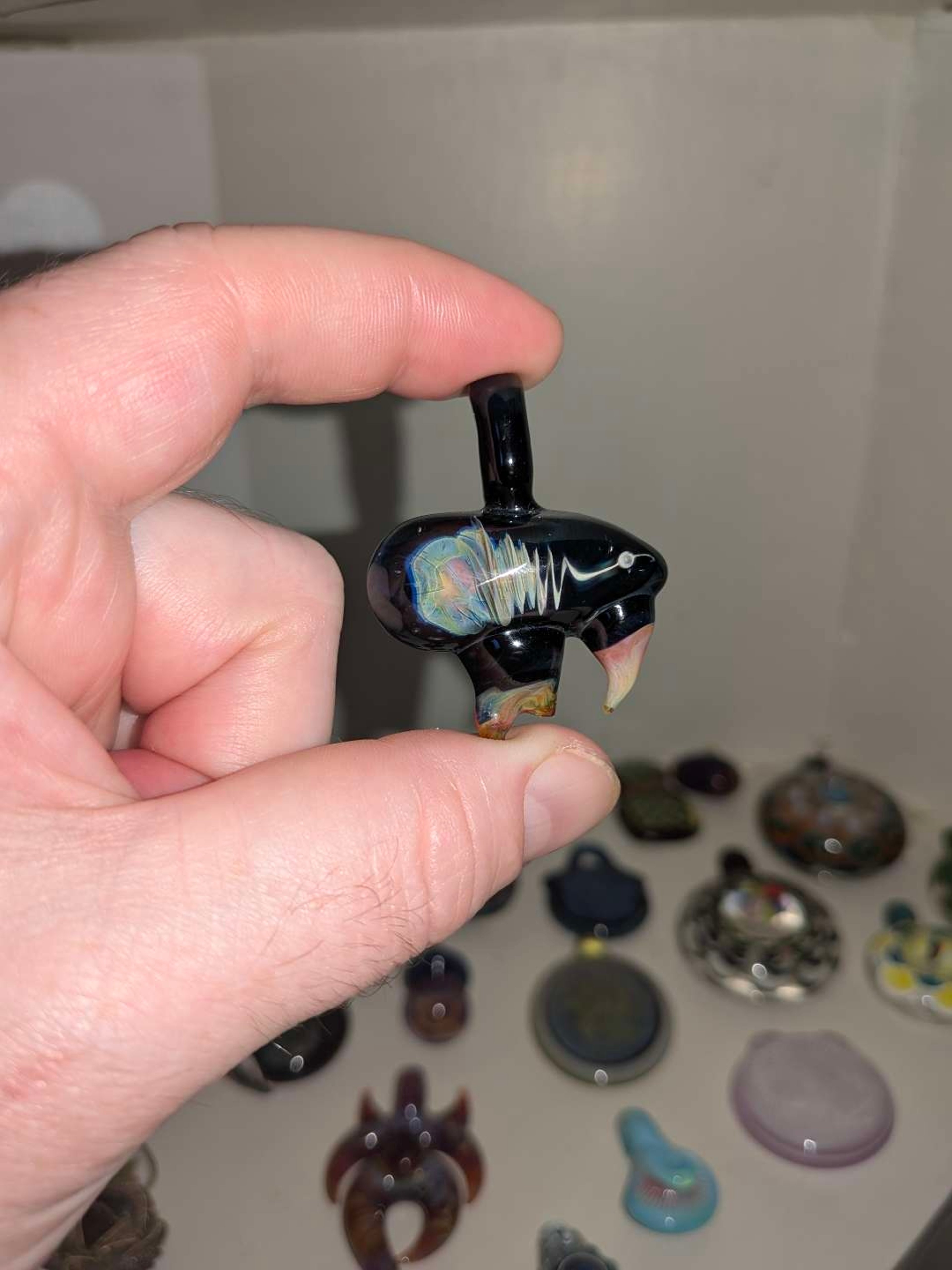 Preview pic of Fume swirl pendant with horns or teeth, maybe fangs?
