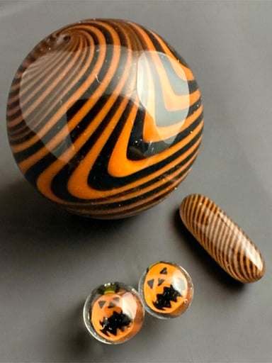 Preview pic of Halloween slerper mib with pill and jack-o’-lantern terp pearls.
