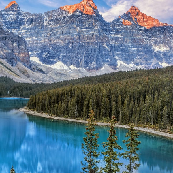 Morning alpenglow over Moraine Lake in Banff National Park in the Canadian Rockies