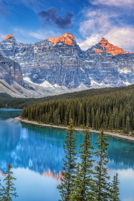 Morning alpenglow over Moraine Lake in Banff National Park in the Canadian Rockies