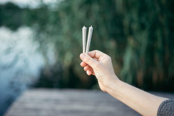 Marijuana Joint cannabis cigarette in hand