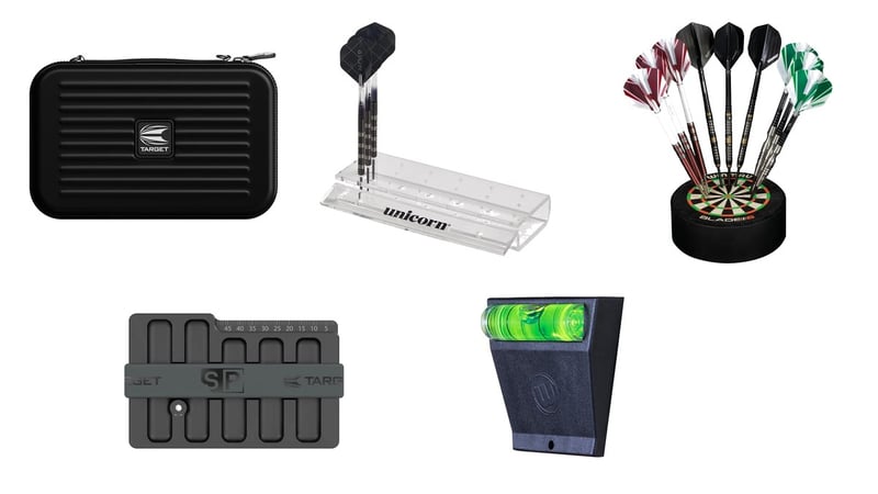Small darts gifts together: a Target darts wallet, a Unicorn acrylic dart stand, a Winmau Dart Dock, a Swiss Point Safe and a Spirit Master level