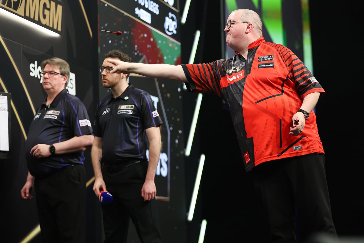 Stephen Bunting completing his follow-through with arm fully extended towards the board