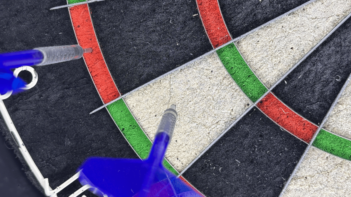 A dart in the single 16 segment, illustrating a cover shot that leaves double 8