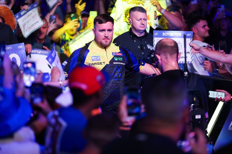 Luke Littler walking out through the crowd for a PDC match in his Target shirt