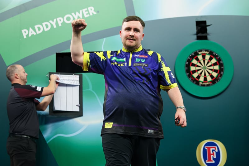 Luke Littler throwing darts at a PDC event