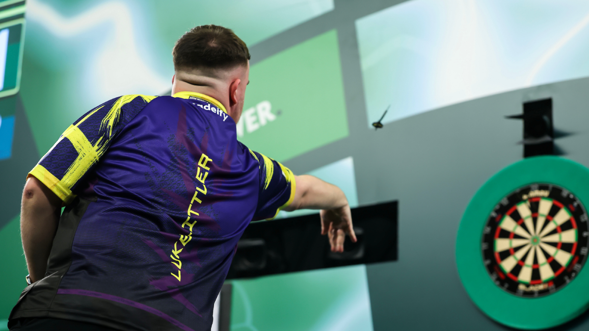 Luke Littler demonstrating proper throwing technique at a PDC event