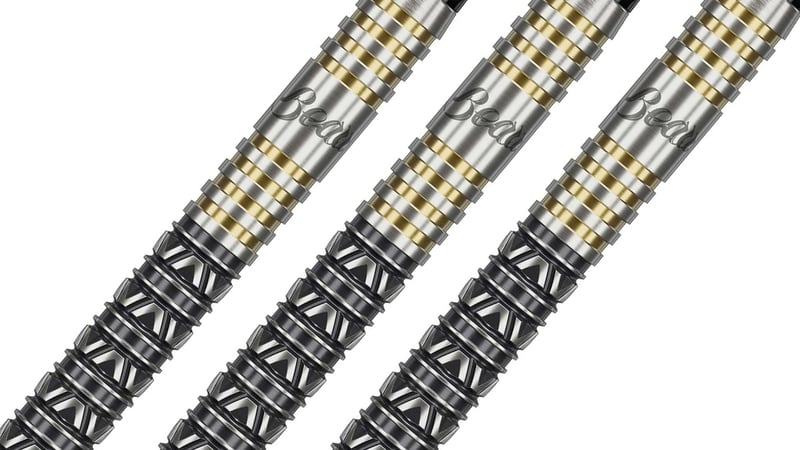 Target Beau Greaves Japan Edition dart barrels at an angle showing the black V-cut front grip and the gold ring bands at the rear