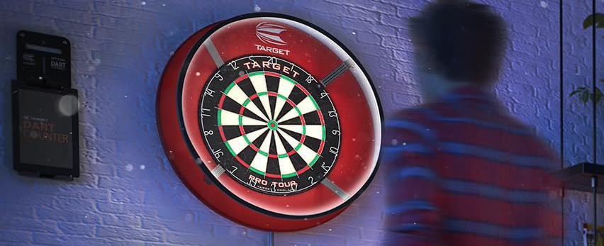 Target Corona Vision dartboard light illuminating a board in a home darts setup