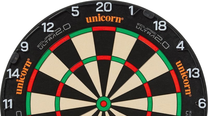 Upper half of the Unicorn Eclipse Ultra 2.0 dartboard face showing the orange Unicorn branding and black Venom spider