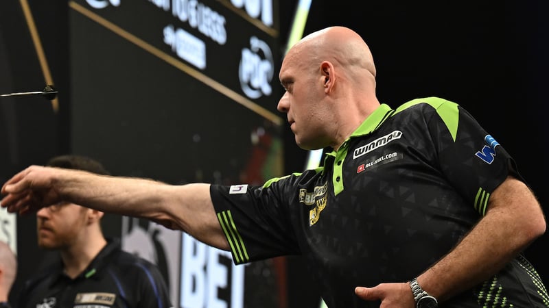 Michael van Gerwen throwing darts at a PDC event
