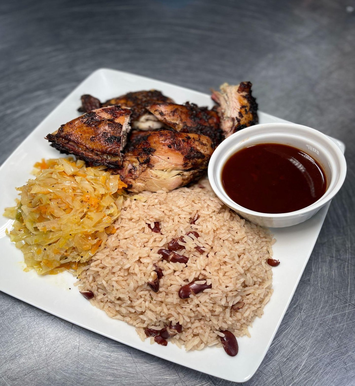Jerk Chicken with Steamed Cabbage, Rice and Beans