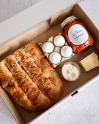 gooooooood morning 😇 our shakshuka kit is $25 and includes our signature shakshuka sauce made with pilpelchuma chili paste and san marzano tomatoes. plus 4 eggs, percorino, toum (garlic paste) + barbari bread. link in bio to make your brunch dreams come true 🍳