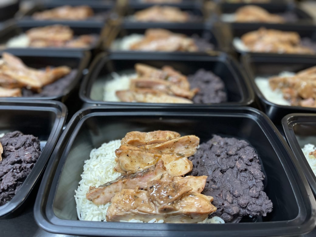 Jerk chicken over stewed black beans and basmati rice