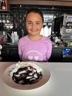 Charlotte posing with her special dessert that she created! 