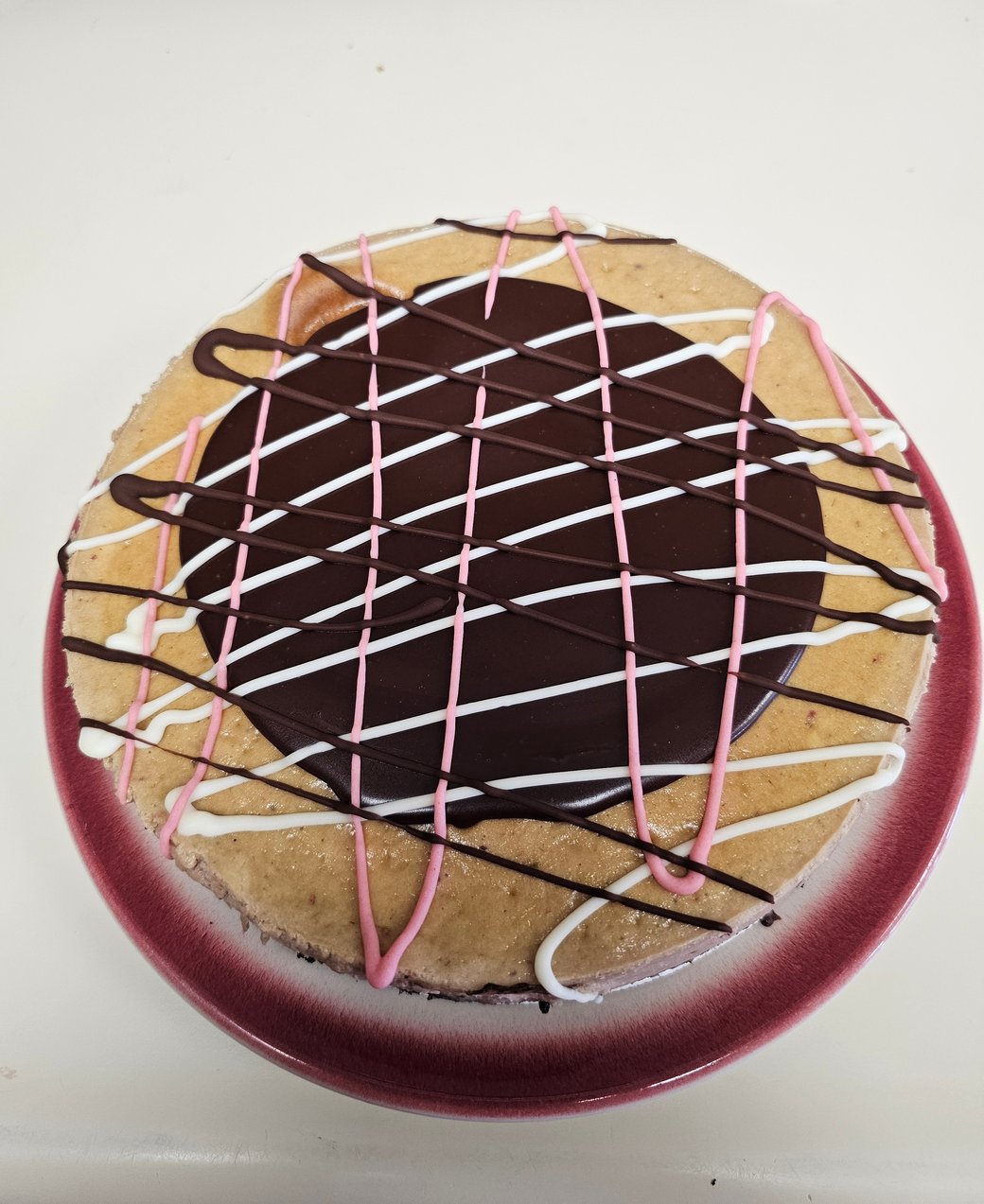 This Month's Spotlight Cheesecake: Triple Chocolate Raspberry