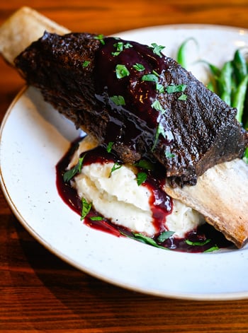 44 dollars. One short rib. Enough to feed your patriotism AND your appetite. 🇺🇸 Our Goliath Tomahawk Short Rib — slow beer-braised, blackberry demi, whipped potatoes — is the July 4th main event. Skip the smoker. We did the hard work for you. Reserve your table at Stillwaters Tavern. 

#StillwatersTavern #TomahawkShortRib #July4th #AmericanScratchKitchen