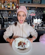 Leïla is very excited about her custom made super whipped cream dessert! 
