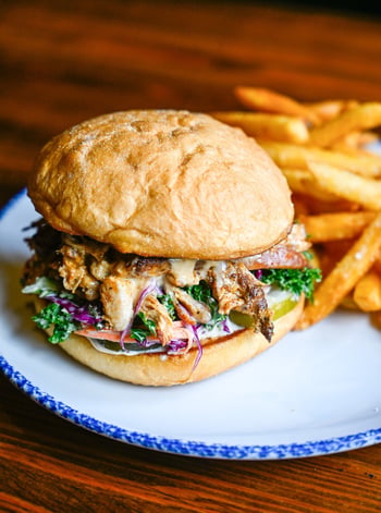 Smoked pulled chicken, Alabama white BBQ sauce, southern slaw, house-made pickles, brioche bun. The Bama Smoked Chicken Wich. No shortcuts.

📸 Bama Smoked Chicken Wich

#stillwaterstavern #smokedchicken #alabamabbq #stpeteeats #tampabay