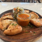 Panzerotti appetizer special.  Fried mini calzone with pepperoni, mozzarella, provolone, and house made marinara. Served with giardiniera and our marinara. Stop in and get it this Friday and Saturday only from 3pm-9pm