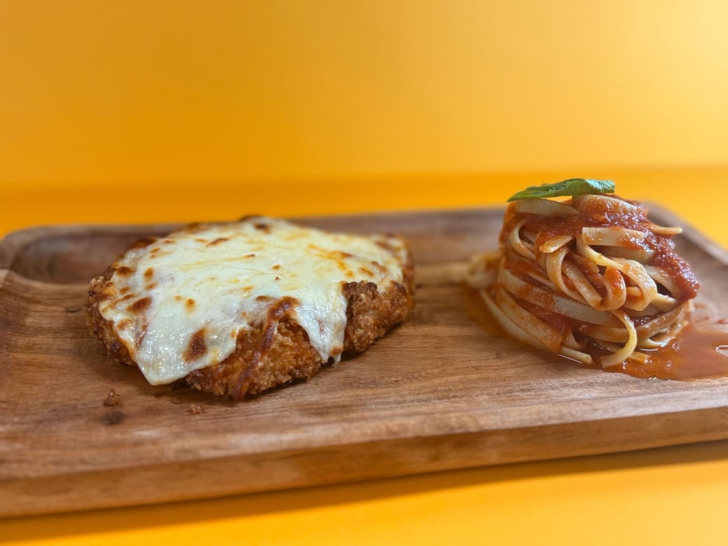 Chicken Parmigiana w/ side fettuccine pomodoro