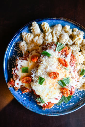 The Trattoria Chicken Parmesan at BellaBrava is not the version you've had before. Smoked prosciutto layered in, Fontina and pecorino Romano over the top, finished with pomodoro, oven-dried tomato, and torn basil, served over your choice of Parmesan radiatori with Asiago crema or spaghetti pomodoro. It takes a dish everyone thinks they know and makes a strong case for reconsidering. 

📸 Trattoria Chicken Parmesan:

#bellabrava #tampamidtown #chickenparmesan #italianfood #tamparestaurants