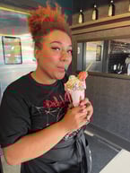 Keshia enjoying our delicious Pretty in Pink milkshake!