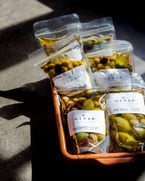 our patio may be closed tonight but our marketplace is OPEN till 5pm today and back open tomorrow at 10am 😇come grab your dips, breads and of course, marinated olives.