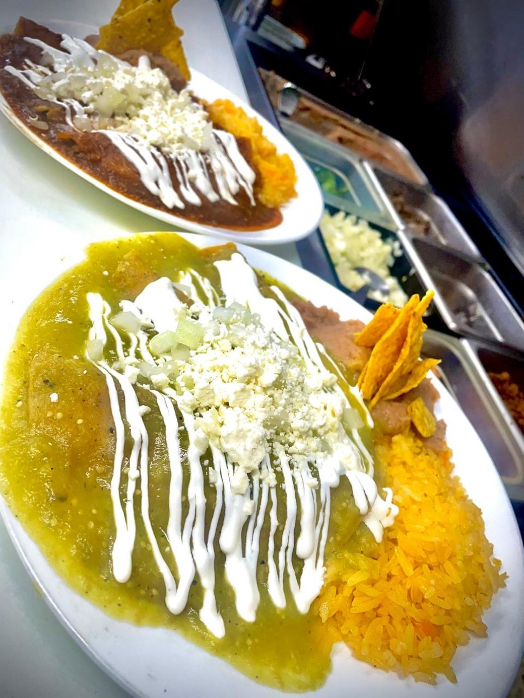 Enchiladas verdes y rojas with meat.