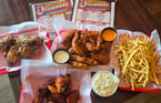 Mother Clucking Football Season Platter - Fifteen golden brown, hand-breaded Mother Clucking Tenders partnered with two large sauces. Fifteen&nbsp;jumbo wings tossed in your favorite sauce or dry rub teamed with two sauce choices. Large thin-cut, crispy fries cooked fresh to order and lightly seasoned. Large creamy coleslaw freshly prepared with the perfect balance of crunch and sweetness. $39.95