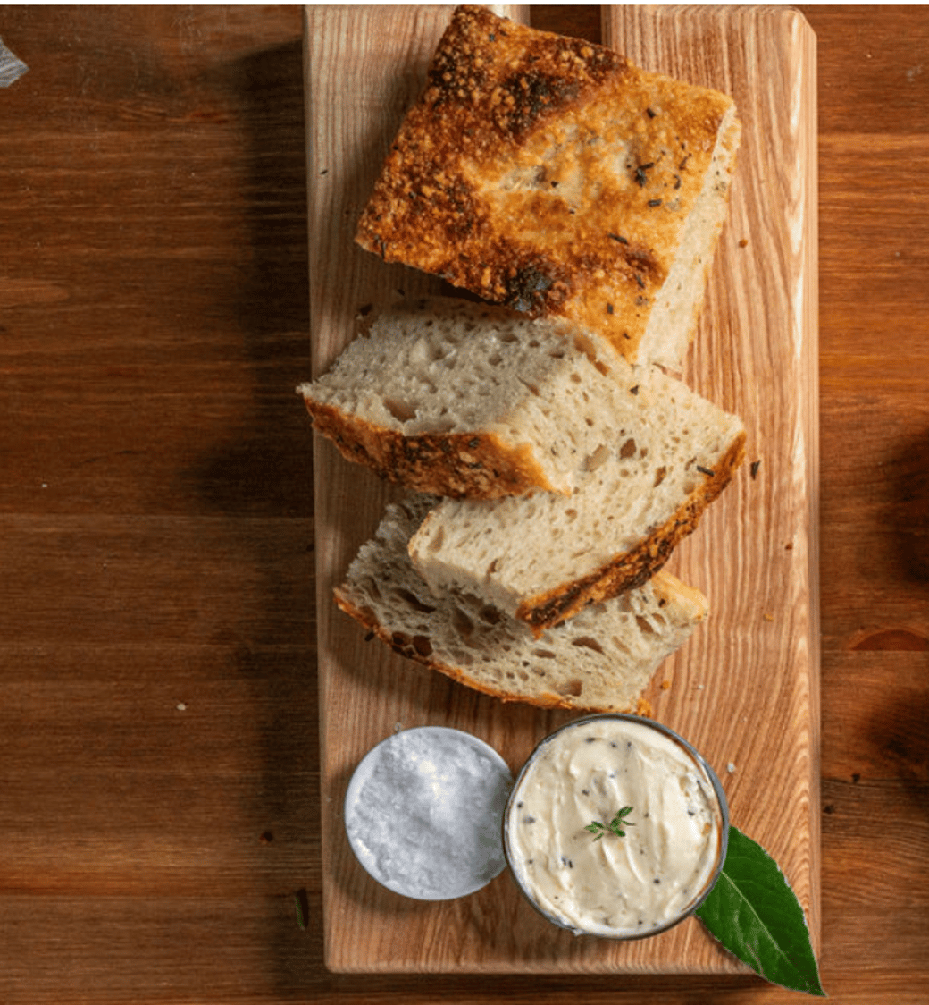Fresh Baked Sourdough, Garlic & Rosemary Focaccia served with Basil Oil