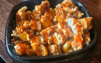 Cluckaroni - White cheddar mac and cheese topped with our amazing Mother Cluckers chicken tenders diced to ensure you get some with every bite! Topped with your choice of sauce. $9.00 (Make it a combo for $12.00)