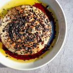 oh baby this baba 😍 our BABAGANOUSH features: house-made date molasses, black sesame seeds, + isot pepper for a little bit of 🔥 served with our fremented potato pita, it's the perfect dip for sharing with loved ones on a 🌬️day 

stop in this week - link in bio to book a seat at our table ✨