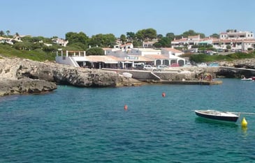 View towards Cala Torret of Bar Paupa and Binibeca Diving school