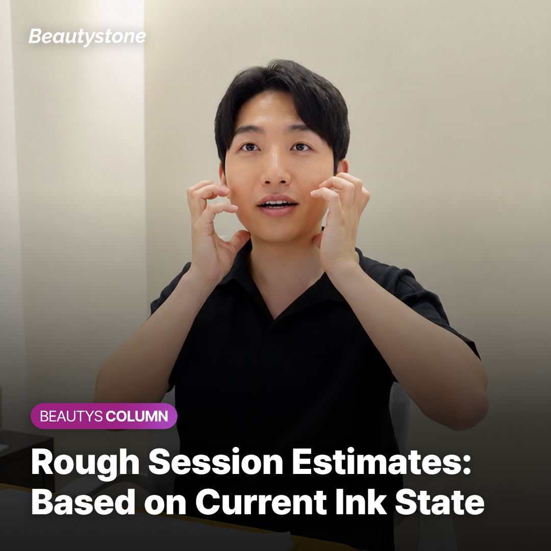 Provider examining a partially removed tattoo to estimate remaining sessions
