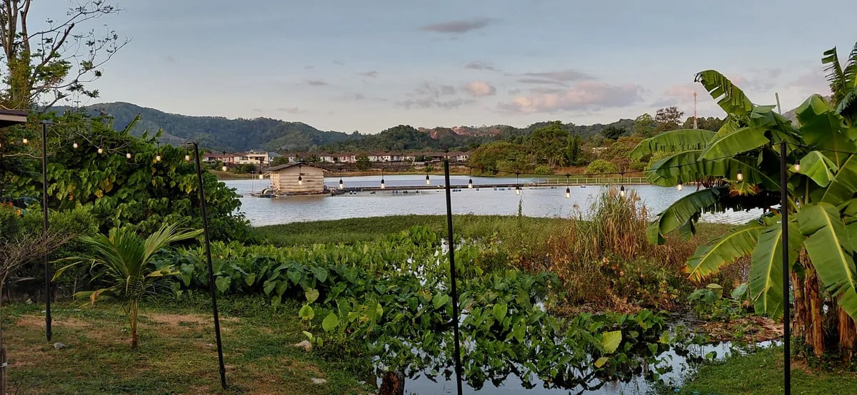 A lagoon backed by hills at dusk in Phuket