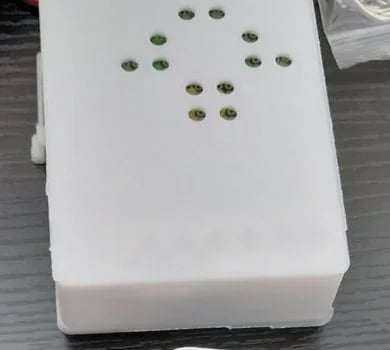 Mushroom LED keyring fitted inside its white 3D-printed enclosure