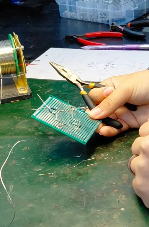 Soldering the mushroom LED keyring at the workbench