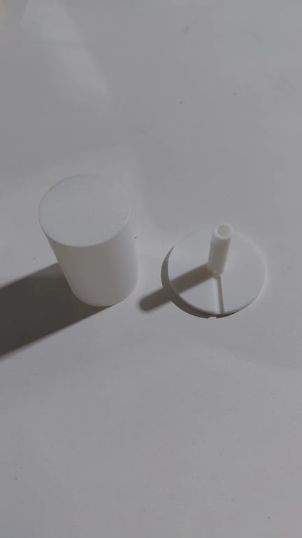 White 3D printed RGB lamp shade and base standing in sunlight